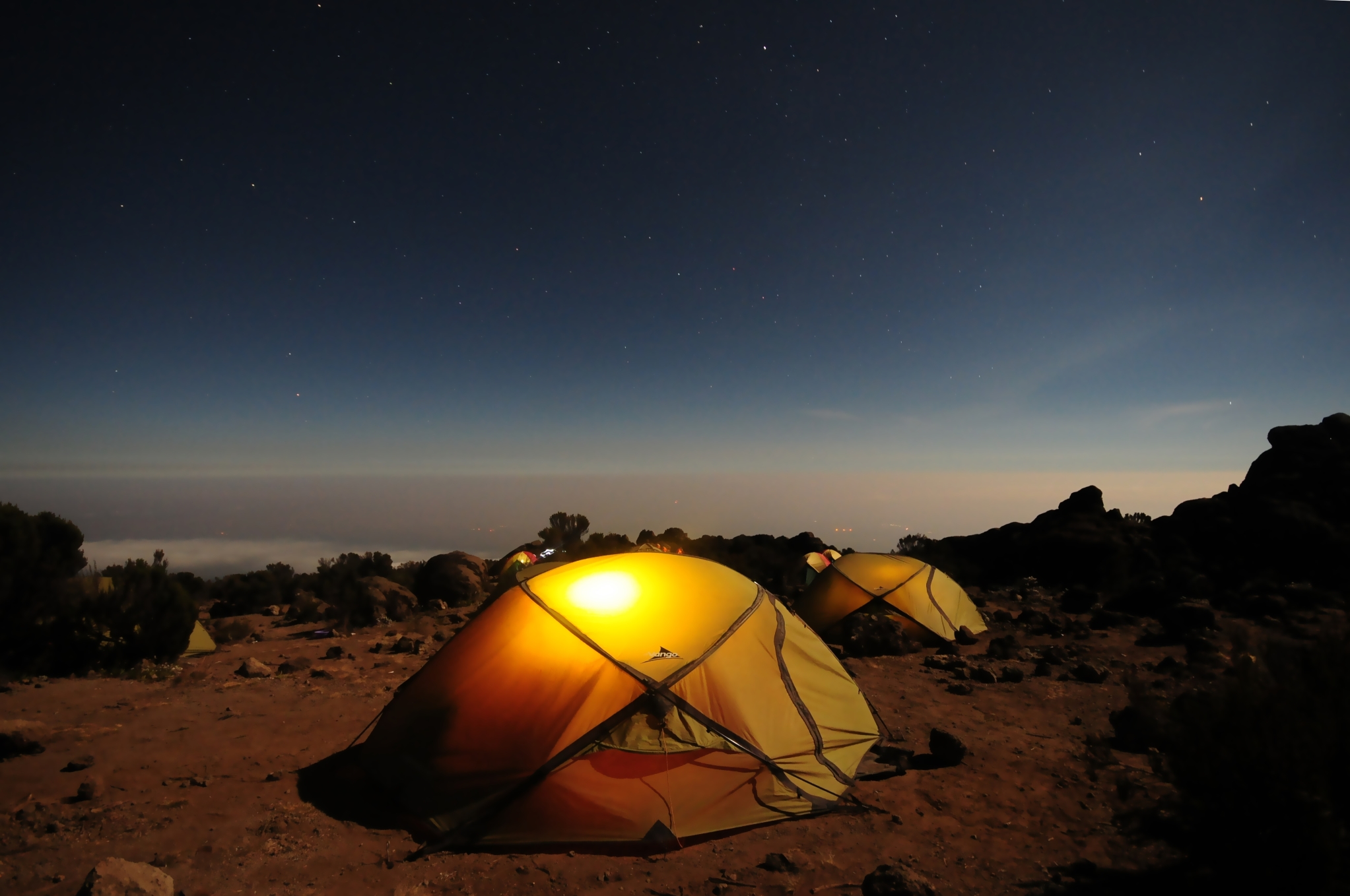 A couple of tents with a nice view of the night sky