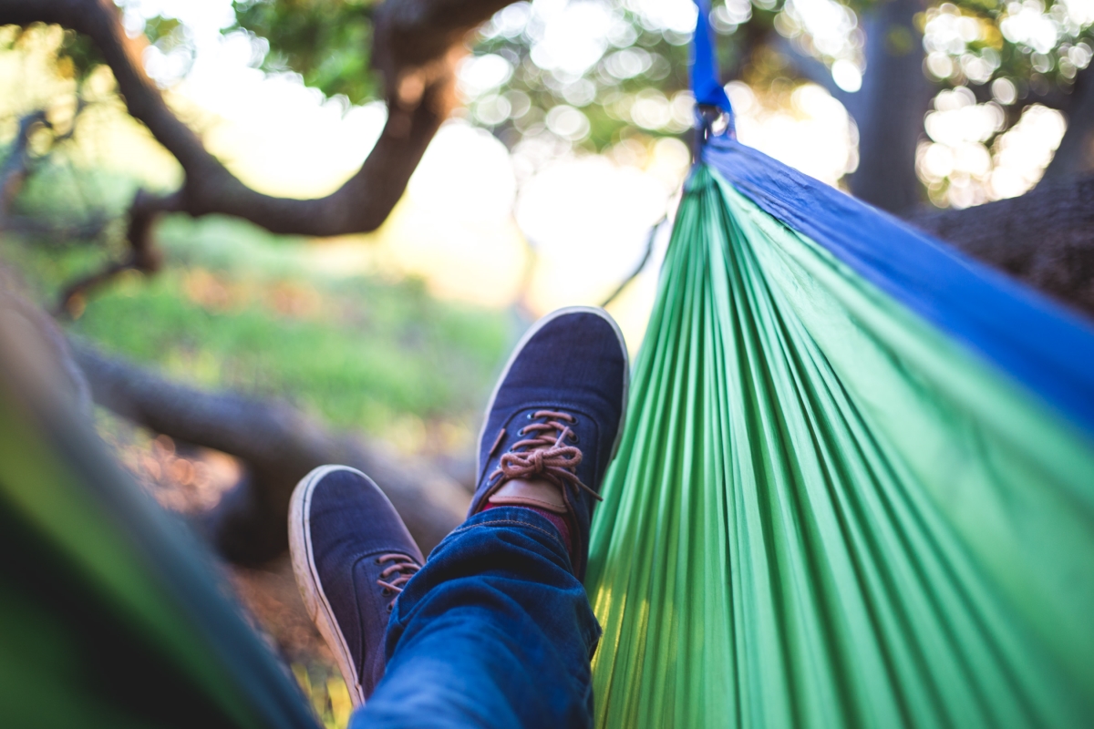 Picture of a person kicking back and relaxing in a hammock